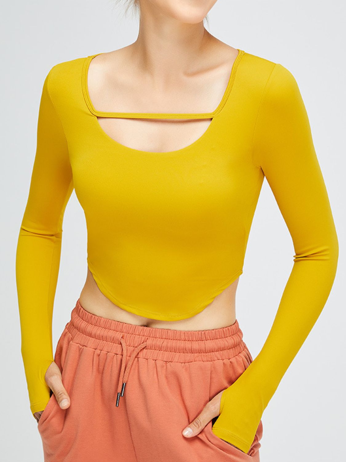 Cutout Curved Hem Cropped Sports Top