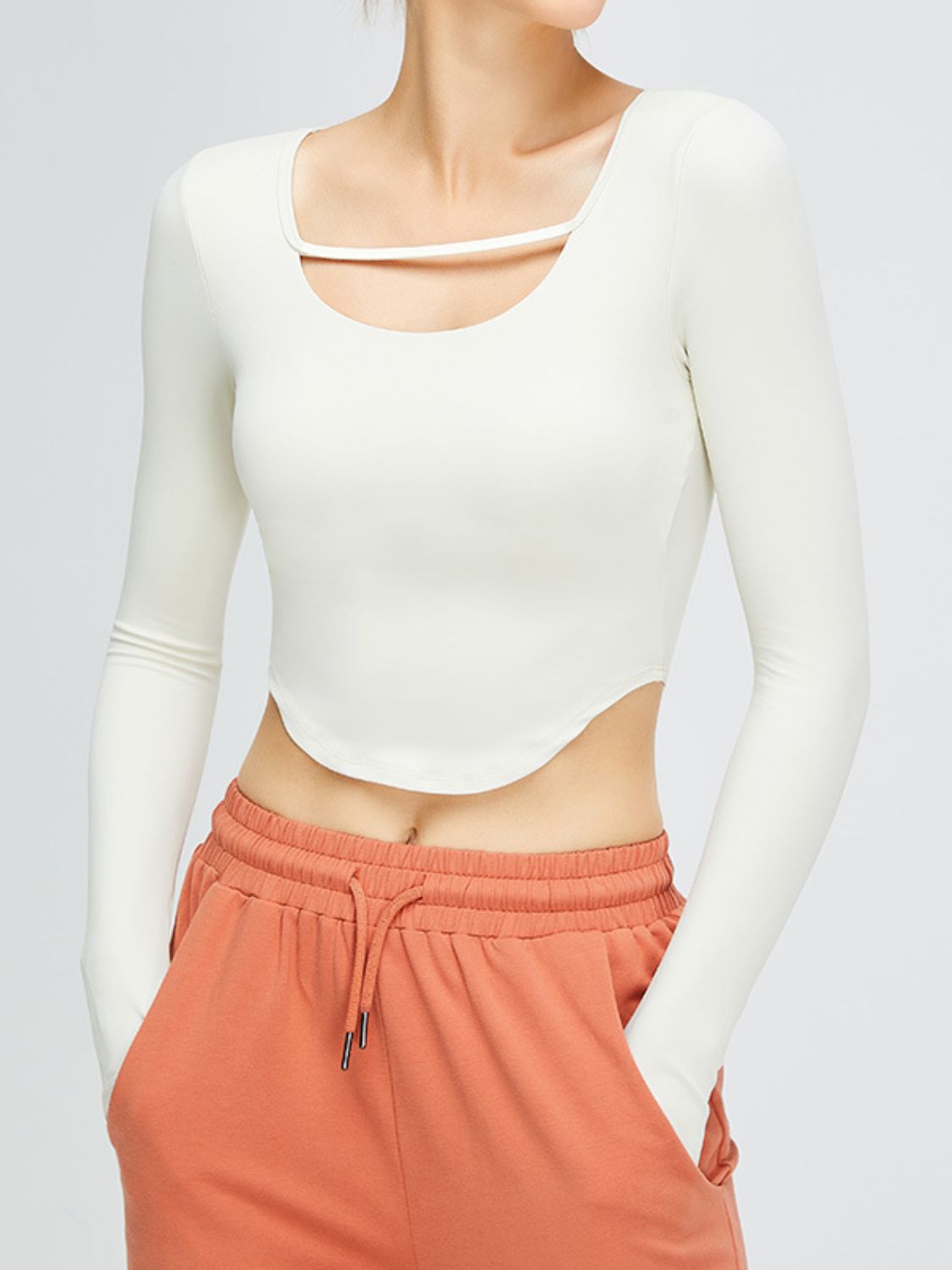 Cutout Curved Hem Cropped Sports Top